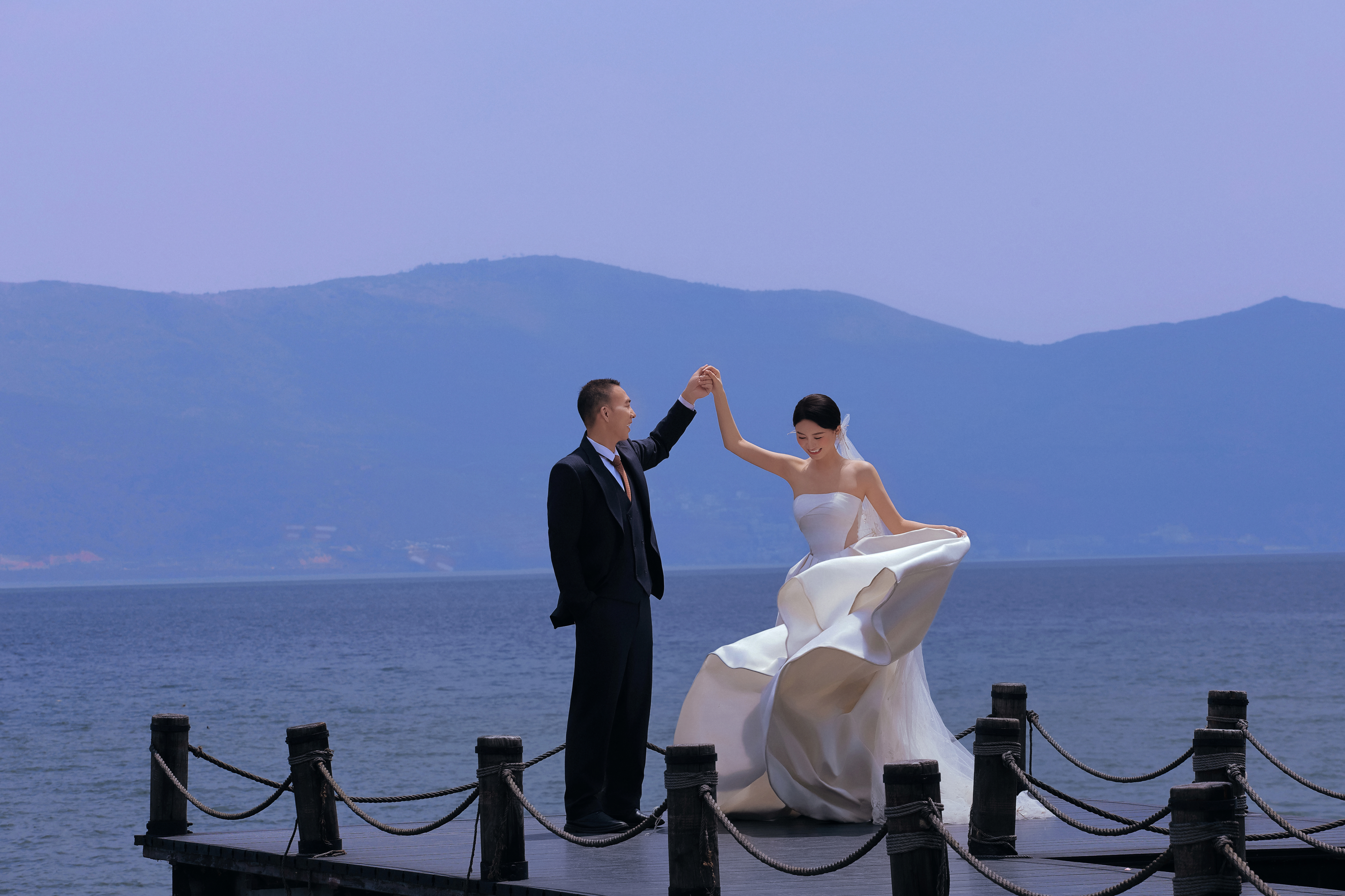 Tao and Xin dancing on the pier